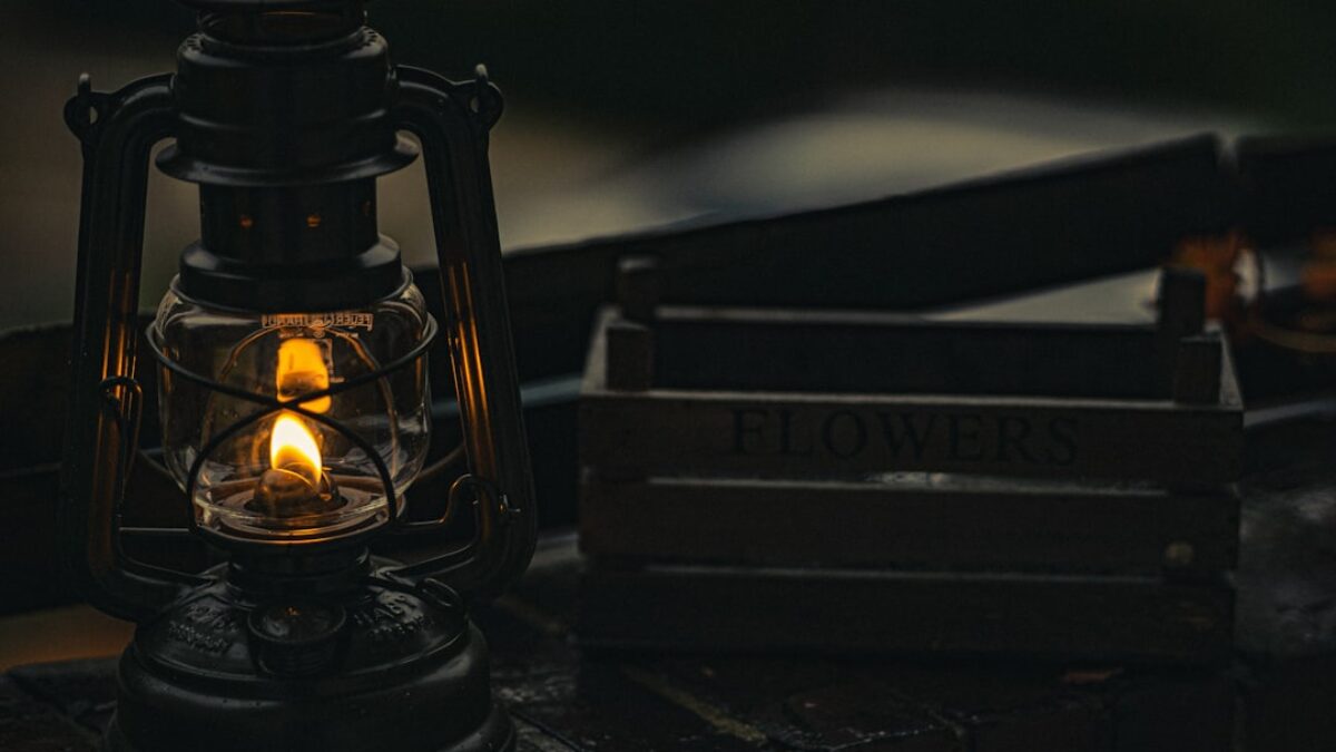 black lantern on black wooden table