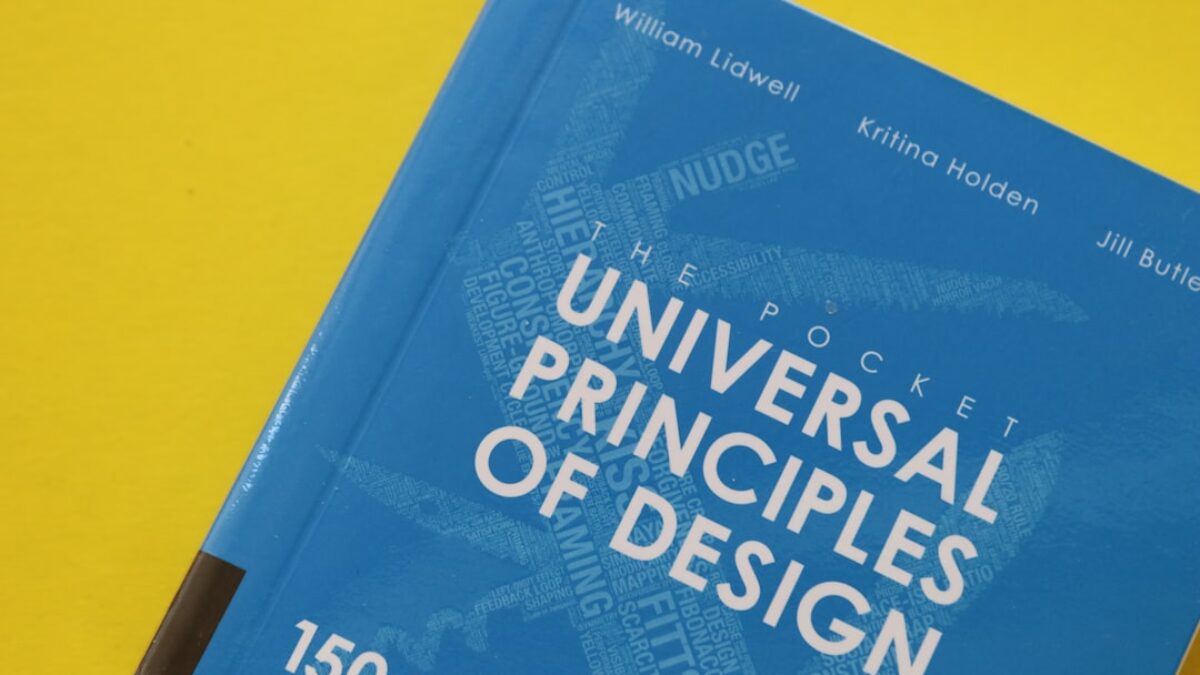 blue and white book on yellow surface