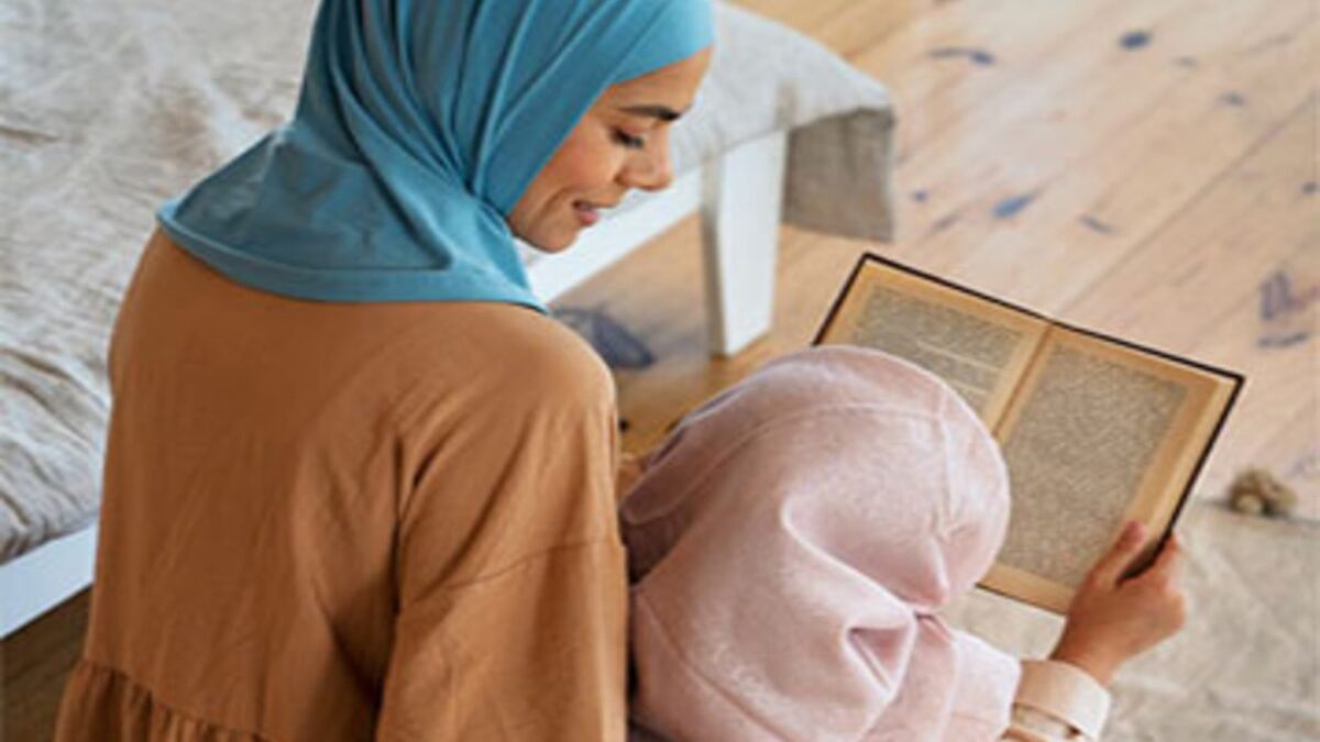 Woman and child reading a book together.